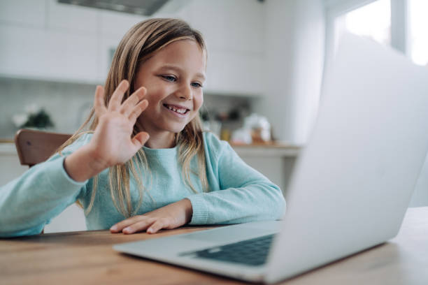 Cheerful girl having video call at home.