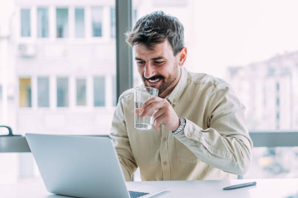 istock Successful businessman in modern office working on laptop. 2148308299