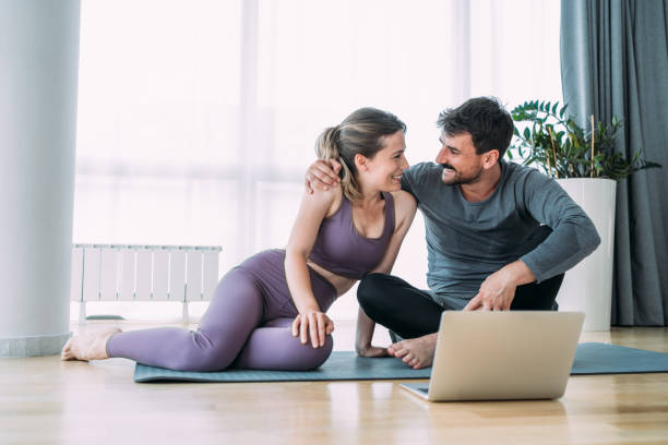 istock Couple exercising together at home. 2148308308
