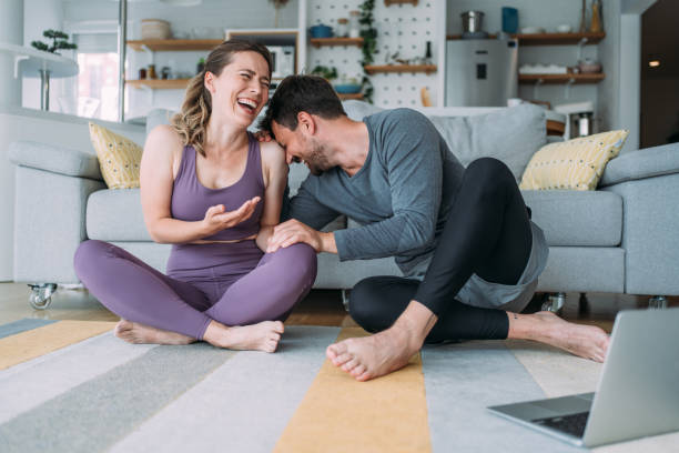 Couple exercising together at home.