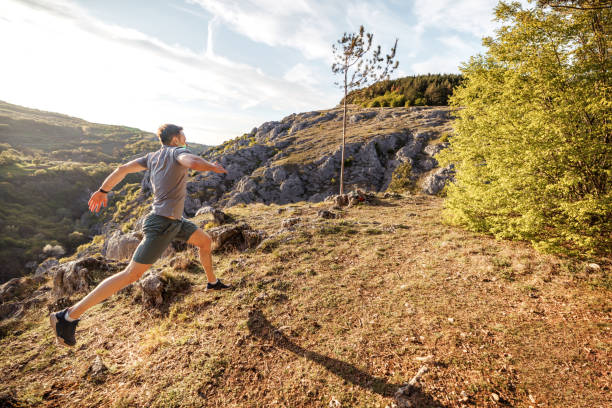istock Young athletic man running at the mountain 2148309886