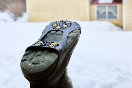 Spiked lining on sole of rubber boot will improve grip on icy surfaces in winter.