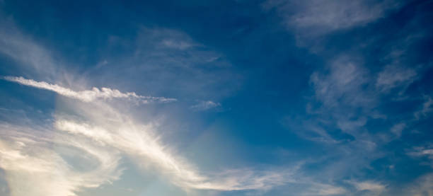 istock sunset sky with clouds and bright light. Wide photo. 2148311869