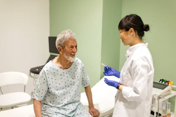 istock Female doctor talking with her senior patient 2148313202