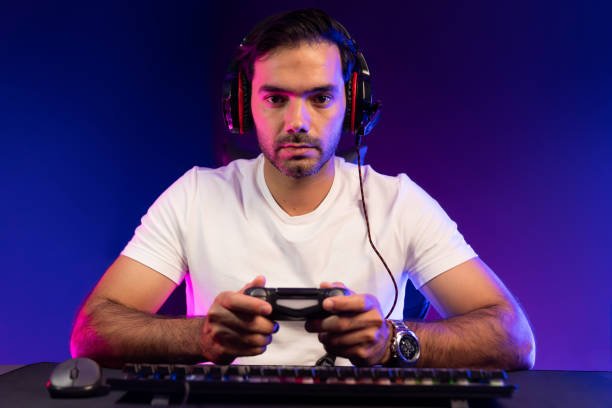 istock Gaming streamer concentrating gaming players with joystick control. Surmise. 2148313342