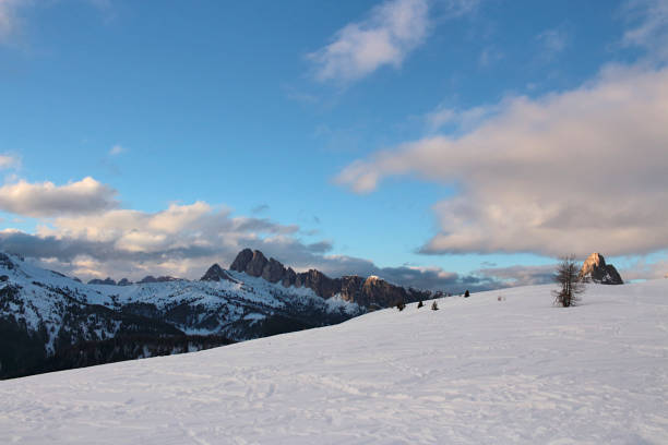 Blue sky and snow in the Italian Dolomite mountains. Dolomites in winter, Cadore, Italy