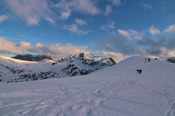 Snow in the Italian Venetian Dolomites in winter. Numerous signs of skiers passing through the snow. Giau Cadore mountain, Italy.