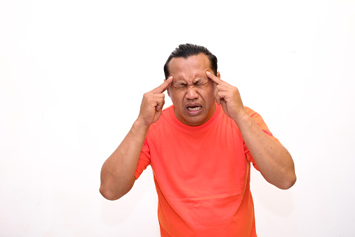 Asian man's expression feeling headache