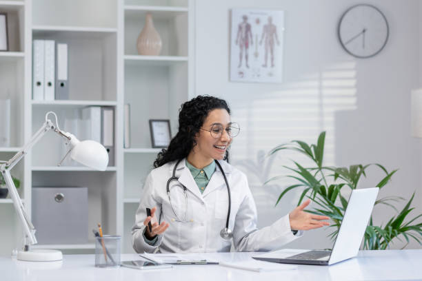 istock Hispanic doctor on a video call with a patient 2148313825