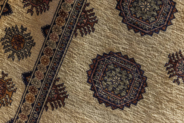 istock Beige oriental silk carpet pattern, close up 2148314434