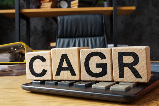 istock Cubes with abbreviation CAGR Compound annual growth rate on a calculator. 2148314757
