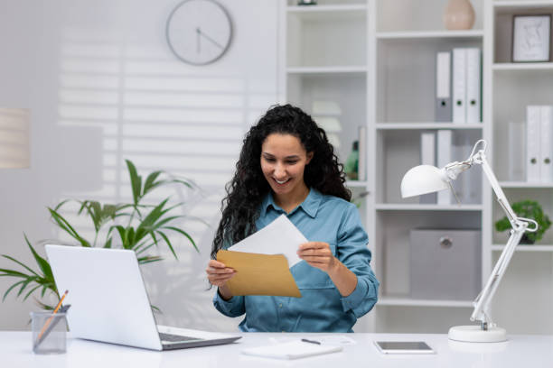 istock Hispanic businesswoman smiling in home office setting 2148315605