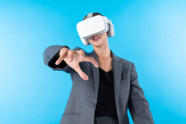 istock Manager wearing VR headset and standing while holding hologram. Contraption. 2148316019