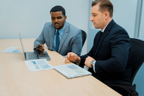 istock African male leader explain strategy while show solution to manager. Ornamented. 2148316134