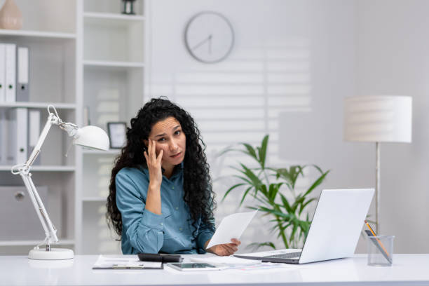 istock Hispanic businesswoman confused working from home office 2148316242