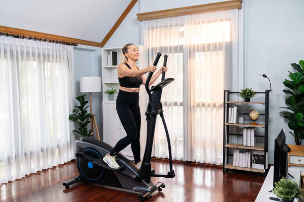 istock Active senior woman running on elliptical running machine. Clout 2148316443