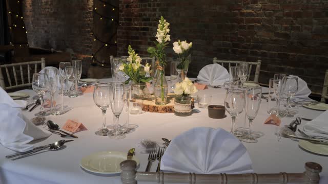 Elegant wedding banquet table setup with a rustic vibe at historic venue.