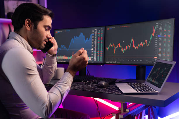 istock Trader calling to broker or partner, analyzing in stock exchange. Surmise. 2148317935