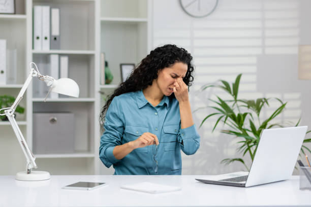 istock Stressed businesswoman feeling headache at work 2148318576
