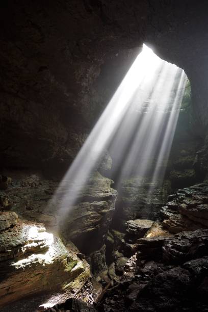 istock Light Beams illuminating the Stephens Gap  Cave Alabama 2148318630