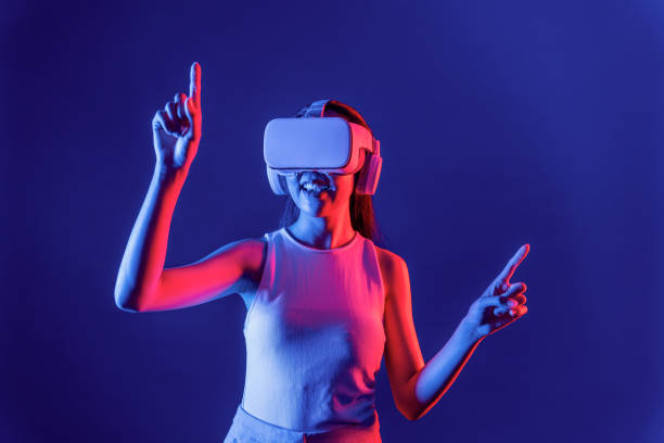 istock Elegant female connect metaverse use finger point virtual object. Hallucination. 2148320219