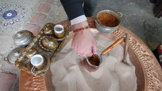 Preparing Turkish Coffee in the Sand