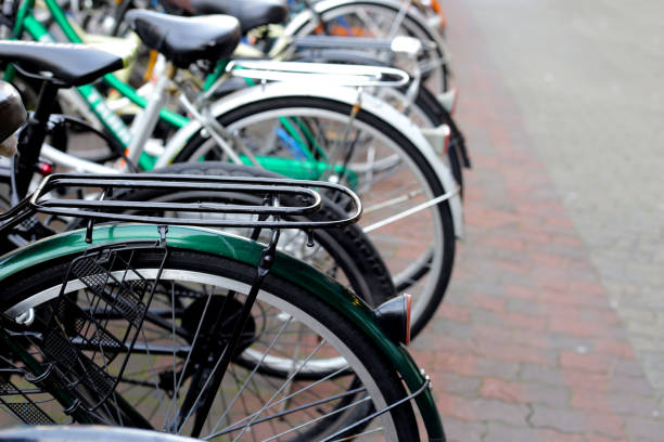 istock A group of bicycles lined up in a row on the sidewalk. 2148320860