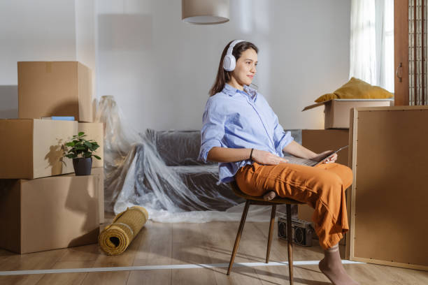 istock Working on laptop in my new home 2148320935