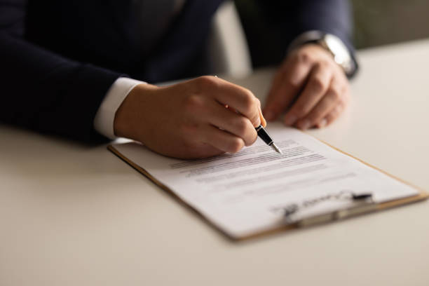 istock Businessman Signing Contract In The Office 2148321041