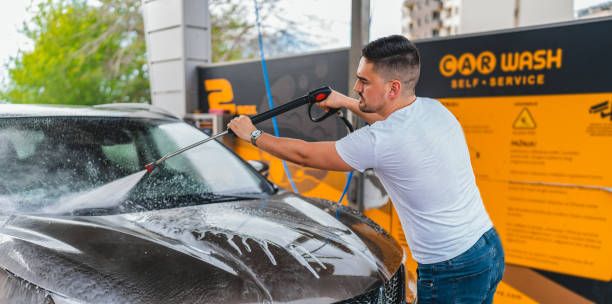 Experience the expertise of automotive professionals as they pamper a car in a service center, providing top-notch care and attention to every inch of the vehicle.