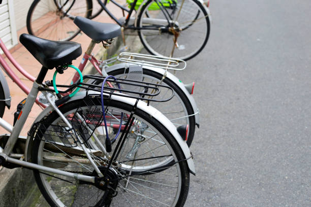 istock A group of bicycles lined up in a row on the sidewalk. 2148321802