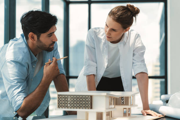 istock Smart architect engineer team working together to measure house model. Tracery. 2148321852