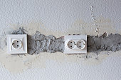 AC power socket in wall. Repairs in the apartment