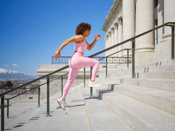 istock Woman Running Up Steps 2148322161