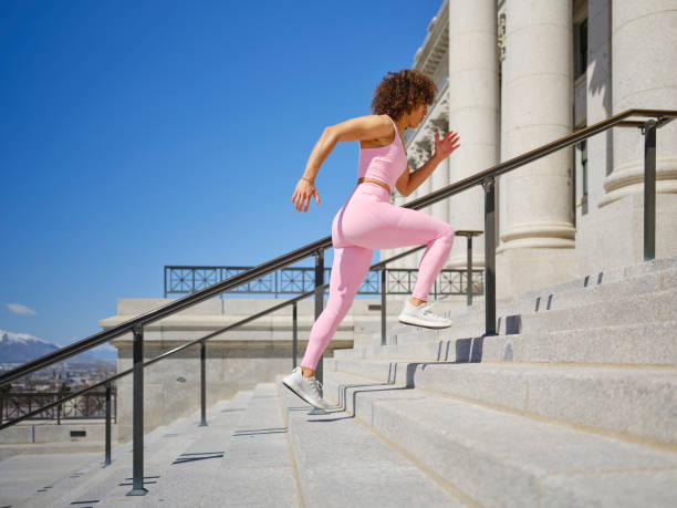 istock Woman Running Up Steps 2148322204