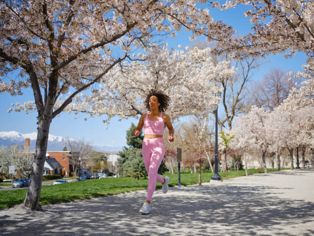 istock Woman Running Among Blossoms in Springtime 2148322530