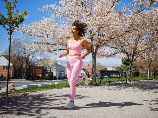 istock Woman Running Among Blossoms in Springtime 2148322556