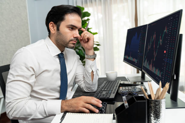 istock Trader analyzing in dynamic stock exchange investment screen on pc. Surmise. 2148323320