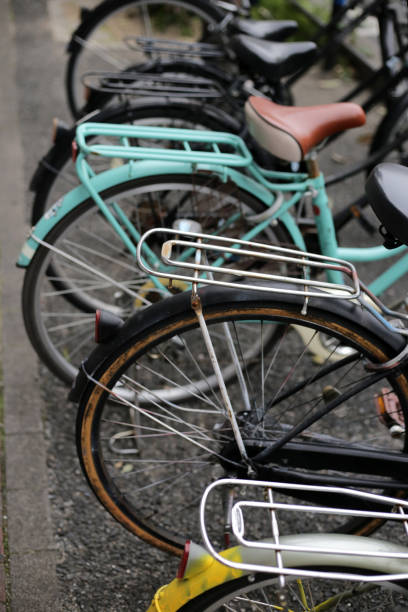 istock A group of bicycles lined up in a row on the sidewalk. 2148323771