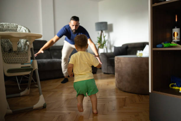 istock Little boy running towards father at home 2148324290