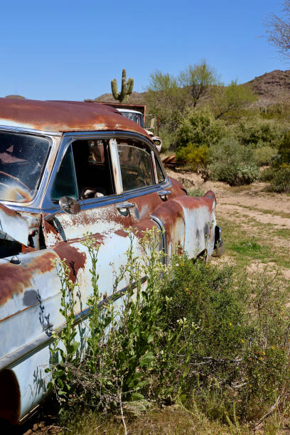 istock Vintage 1950’s car left to rot in the desert 2148325232