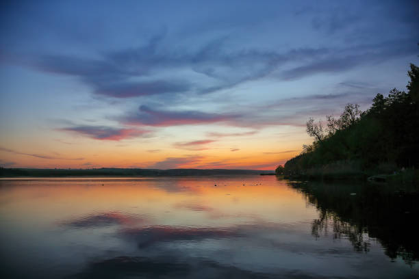 istock Amazing sunset over calm lake. 2148325548
