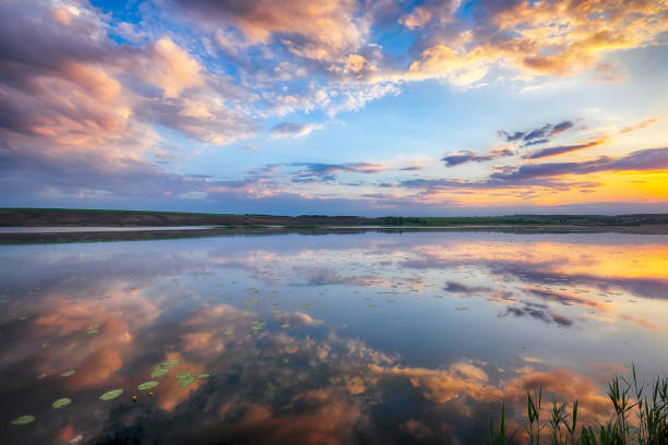istock Amazing Dramatic sunset over the lake 2148325581