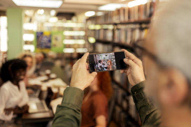 istock Taking Photos With Smartphone at Library 2148325810