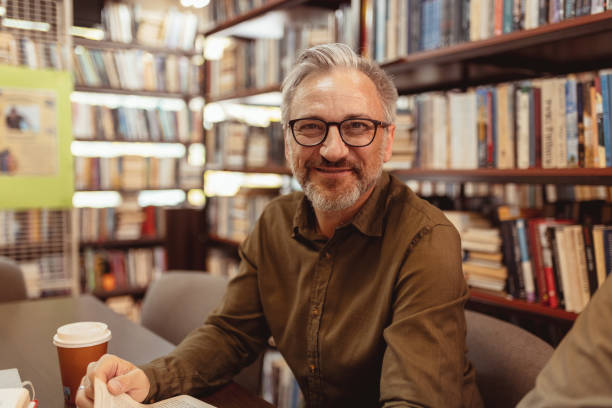 istock Mature Man Looking at Camera at Library 2148326198