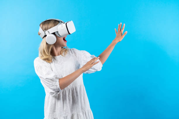 istock Smart girl excited with metaverse by using VR goggle at background. Contraption. 2148326939