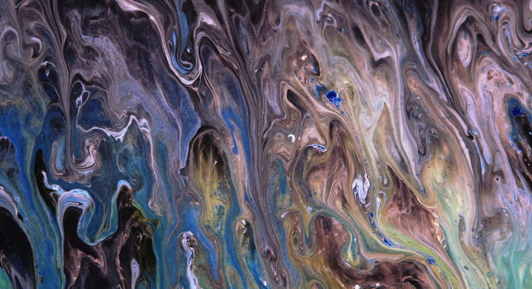 Moving streams of blue, yellow, brown paint on a dark abstract background, screensaver. Liquid abstraction.