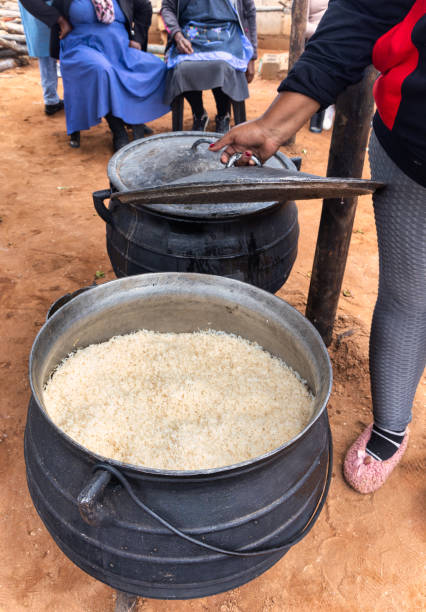 istock pot of rice boiling in an three legged pot, outdoors kitchen african village 2148327565