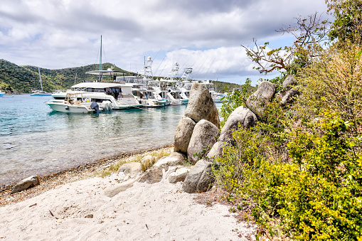 Tortola, British Virgin Islands - March 27, 2024: The beach and pier at The Bight on Norman Island