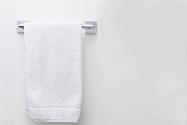 Modern bathroom towel dryer on a white wall background